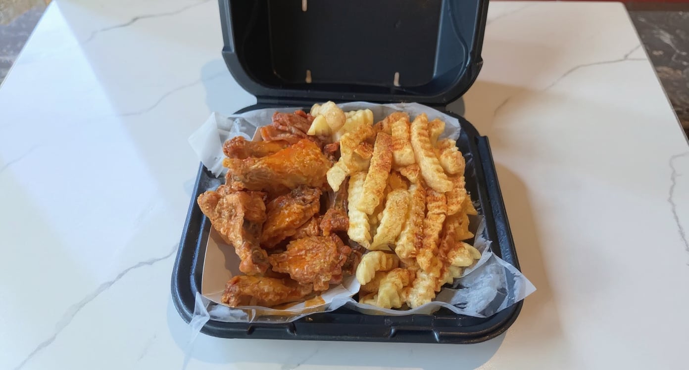 A restaurant's real takeout photo of wings and fries, before and after MenuPhotoLab
